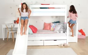 Two Girls On Bunk Beds With Slides