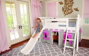 Girl Playing On Play Beds With Slide