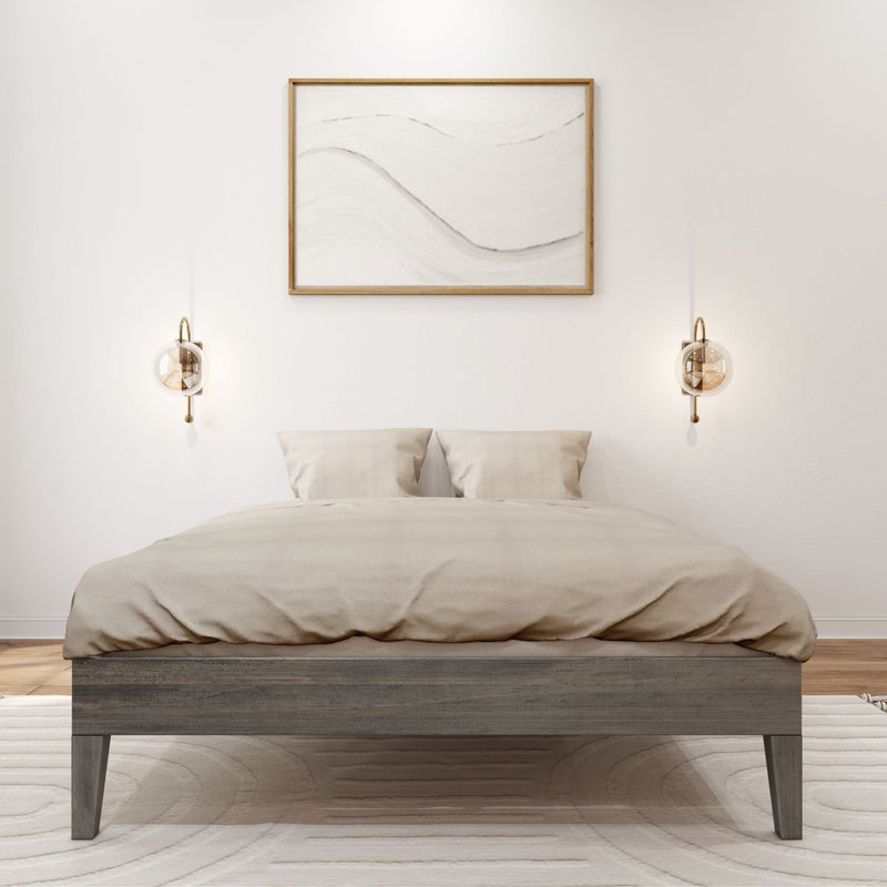 Full Size Platform Bed Driftwood Front View Full Size Platform Bed in Driftwood - front view in a bedroom with tan bedding, two wall sconces, and framed art above