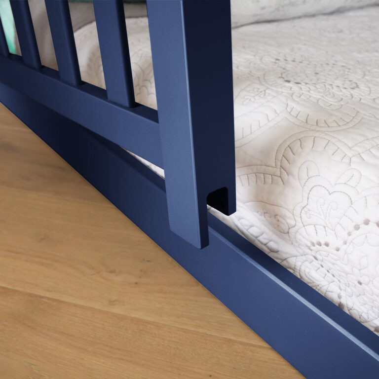 Max and Lily Add on Safety Guard Rail in blue - close-up of the vertical slats and lower rail beside a mattress