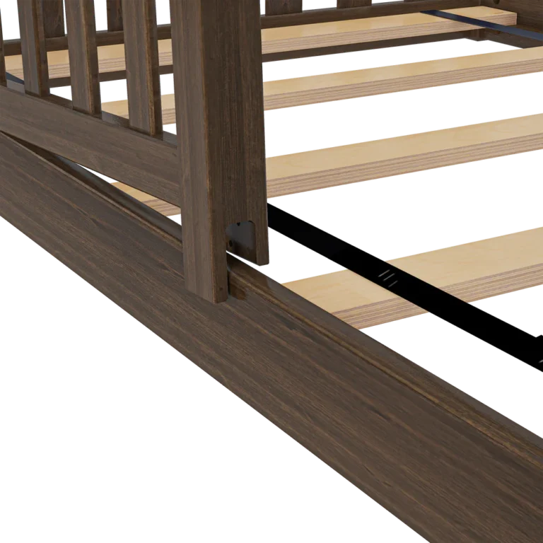 Max and Lily Add on Safety Guard Rail in walnut - close-up of the guard rail mounted to the bed frame above the slatted support platform.