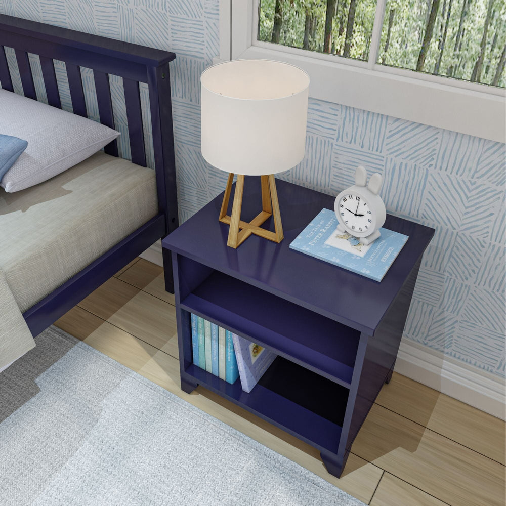 Max and Lily Classic Night Stand With Shelves in Blue - overhead angled view beside a bed with a lamp, clock, and books.