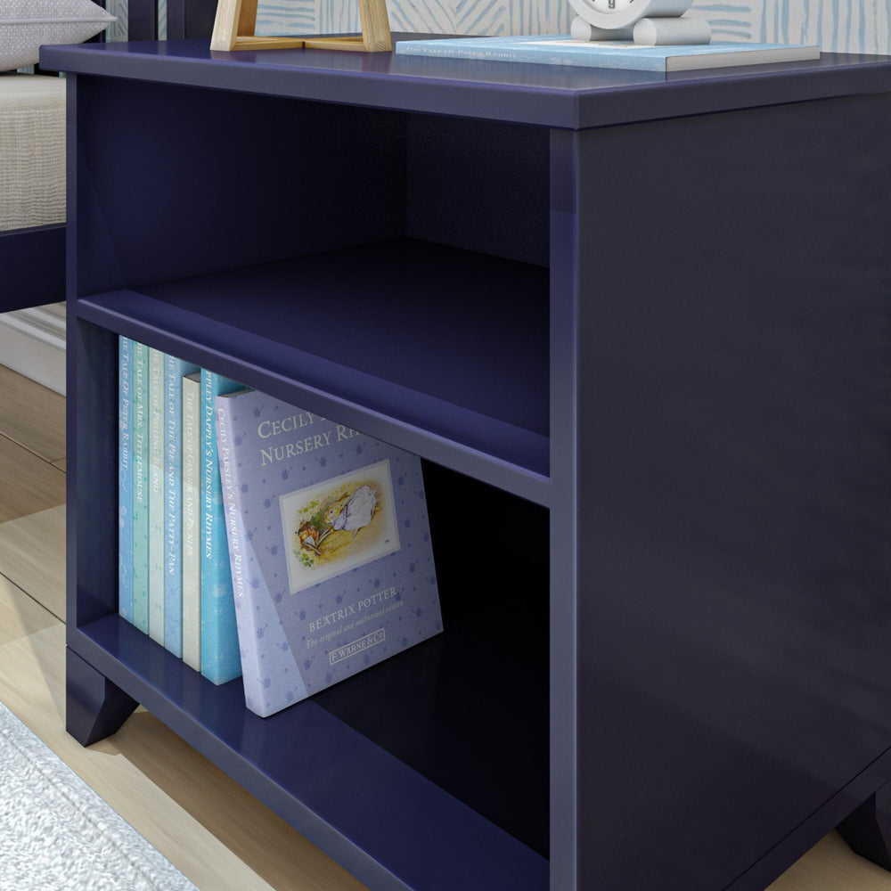 Max and Lily Classic Night Stand With Shelves in Blue - close-up of the open lower shelf lined with children's books.