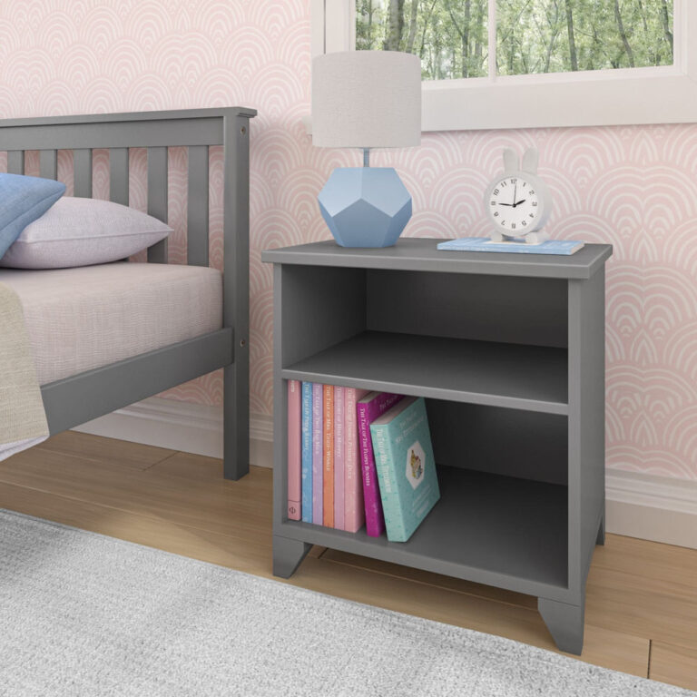 Max And Lily Classic Night Stand With Shelves Grey Room Scene 1 Max and Lily Classic Night Stand With Shelves in grey - shown beside a bed with a lamp, clock, and children's books on the lower open shelf.