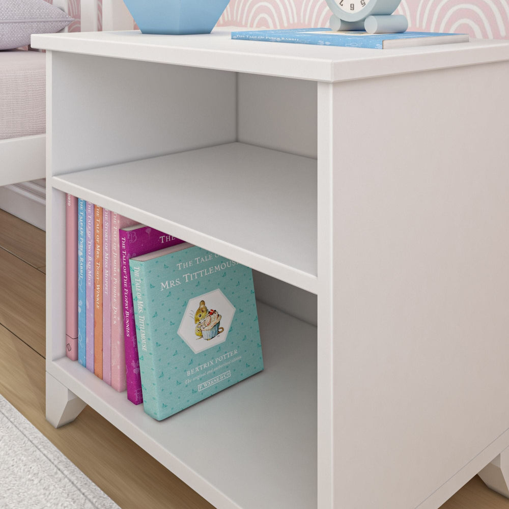 Max and Lily Classic Night Stand With Shelves in White - close-up of the open shelves holding a row of children's books.