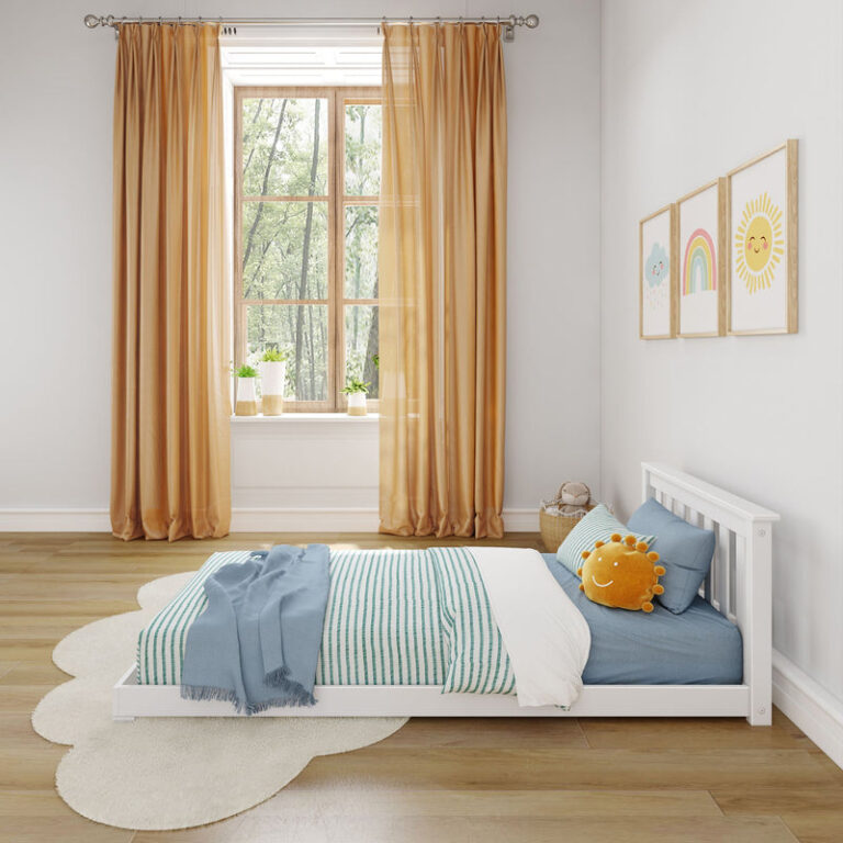 Max and Lily Classic Twin Floor Bed in White - low floor bed styled in a bright room with a curtained window and striped bedding