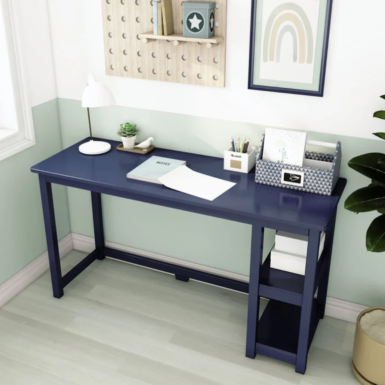 Max and Lily Desk With Shelves in Blue - angled view styled with a lamp, potted plant and desk organizers in a kids room