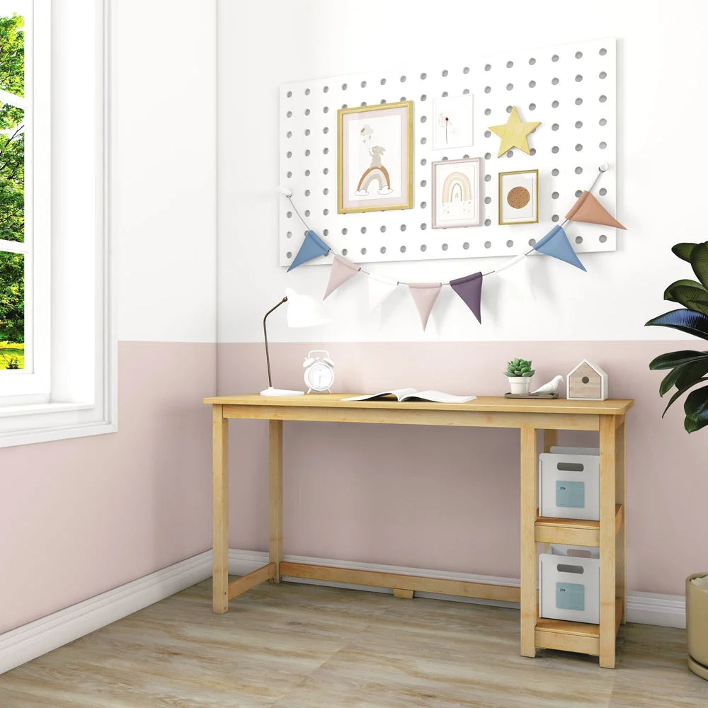 Max and Lily Desk With Shelves in natural - angled room scene beside a window with a pegboard, lamp, and side storage shelves.