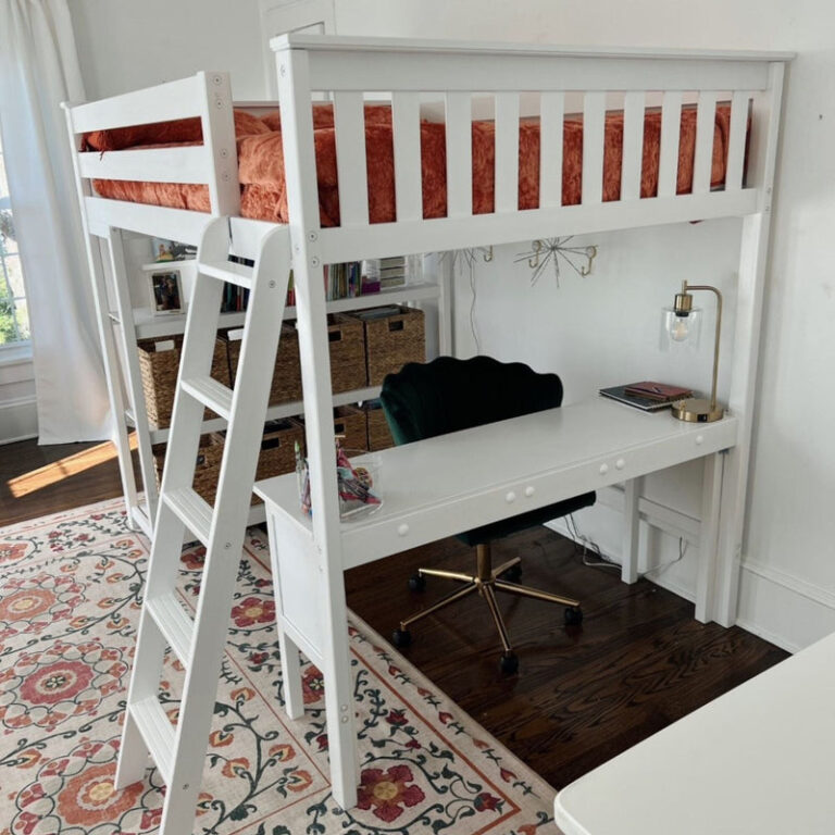 Max and Lily Full High Loft Bed With Bookcase With Desk in White - close view of the workspace beneath the loft with desk, chair, and storage baskets.