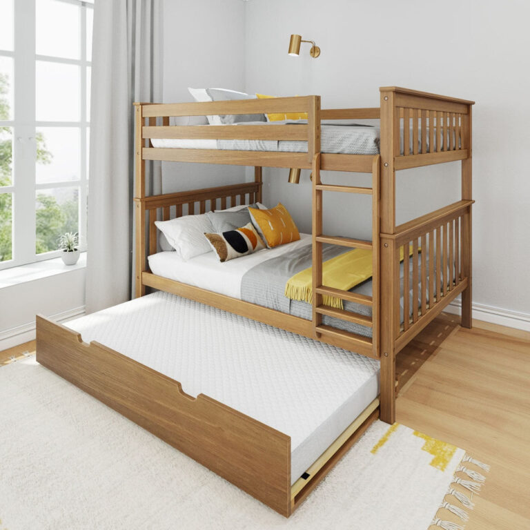 Max And Lily Full Over Full Bunk Bed With Trundle Pecan Angle View 1 Max and Lily Full Over Full Bunk Bed with Trundle in pecan - angle view in a bright bedroom with the trundle bed pulled out and safety guardrails on the top bunk