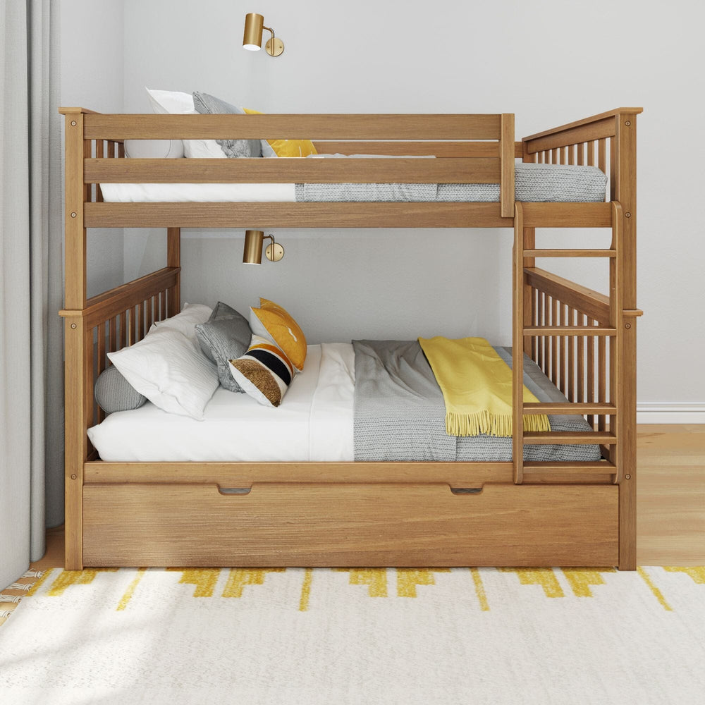 Max and Lily Full Over Full Bunk Bed with Trundle in Pecan - side view in a bedroom showing the attached ladder, full-length guardrails and closed trundle drawer