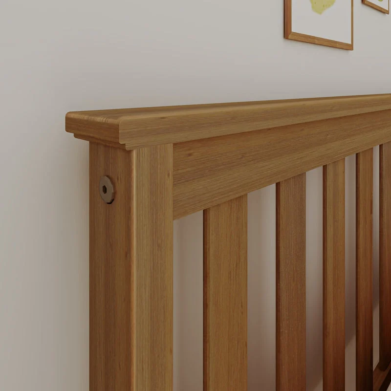 Max and Lily Full Platform Bed With Trundle in Pecan - close-up of the solid wood slatted headboard and rounded post cap