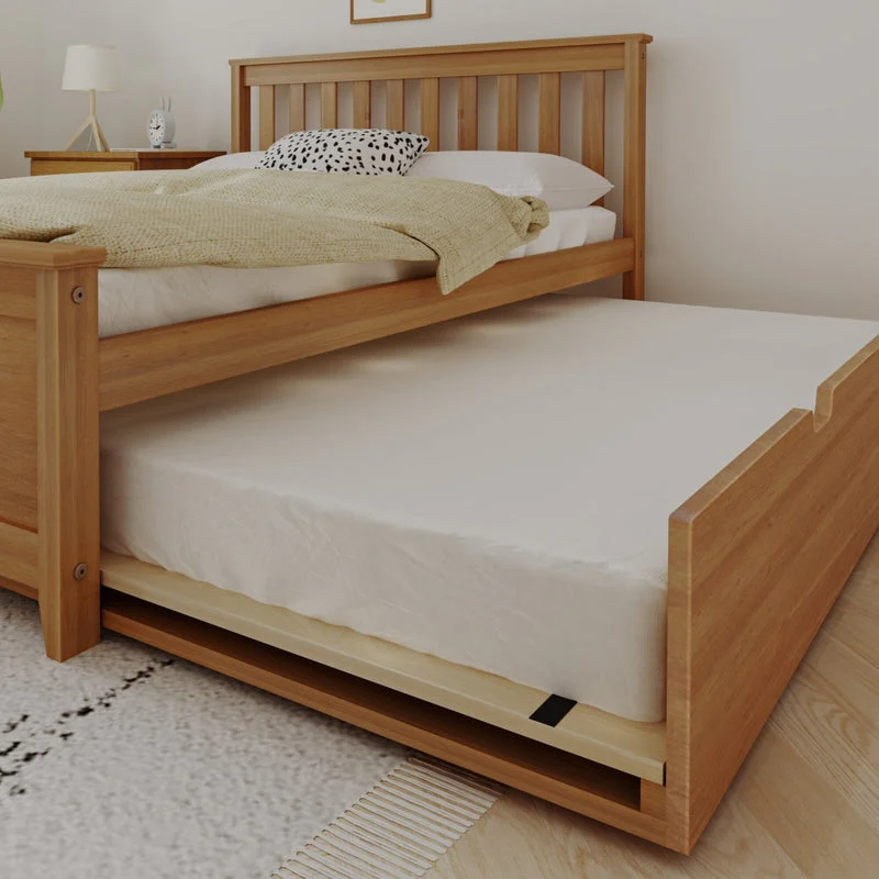 Max and Lily Full Platform Bed With Trundle in Pecan - close-up of the trundle rolled out from under the bed with its mattress in place
