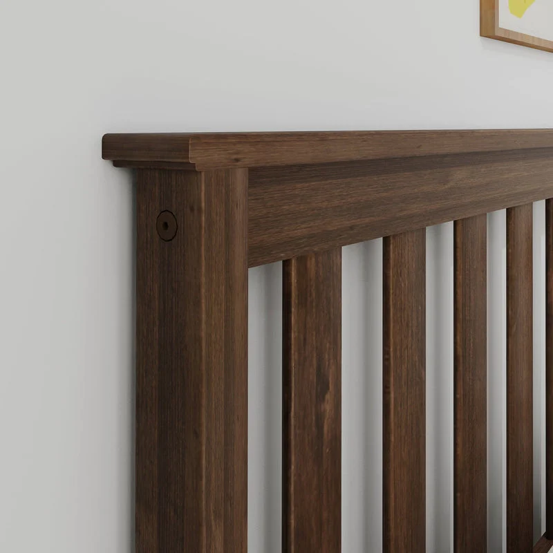 Max and Lily Full Platform Bed With Trundle in Walnut - close-up of the solid wood slatted headboard and corner post