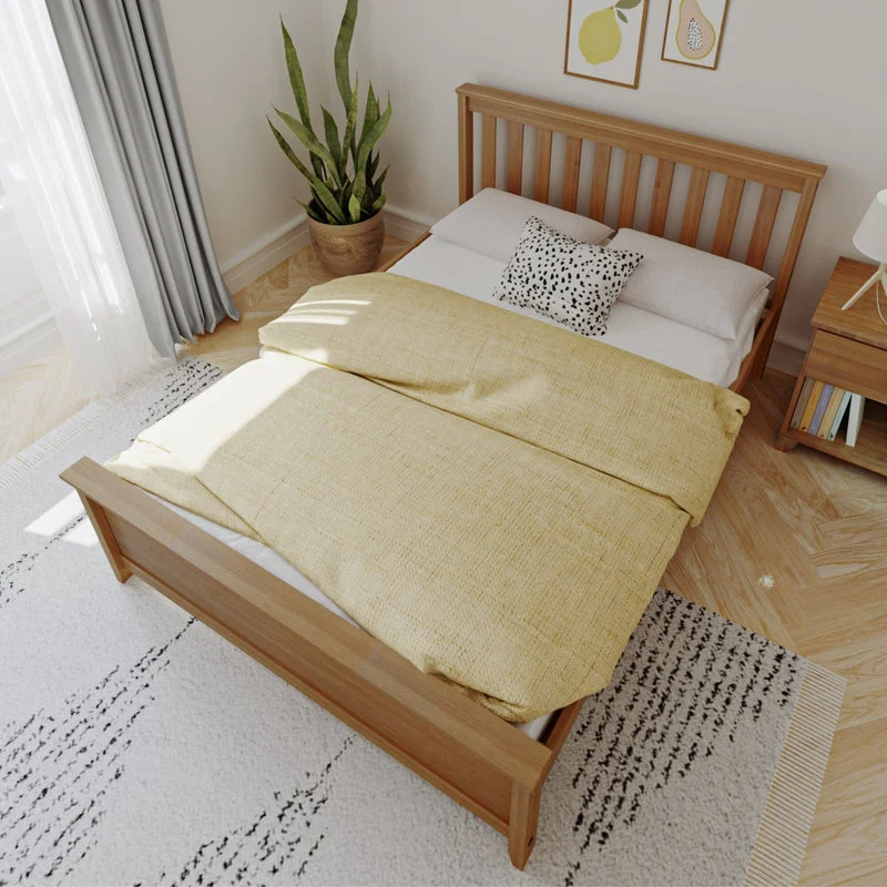 Max And Lily Full Size Platform Bed Pecan Overhead View Max and Lily Full Size Platform Bed in Pecan - overhead view of the made-up bed on a rug beside a window and nightstand