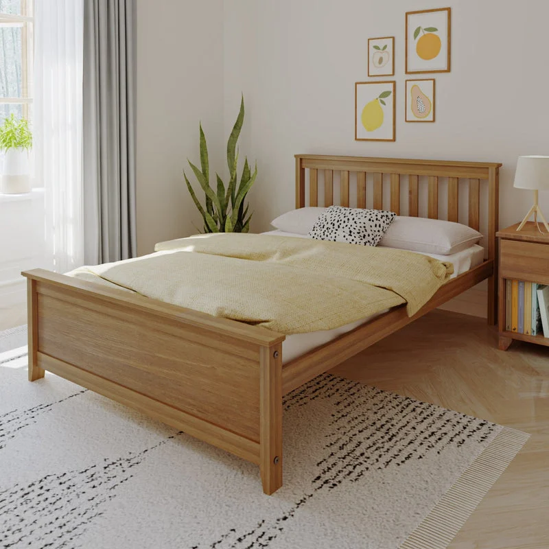 Max And Lily Full Size Platform Bed Pecan Room Scene Max and Lily Full Size Platform Bed in Pecan - angled view of the slatted headboard bed dressed with bedding in a bright bedroom with a plant and nightstand