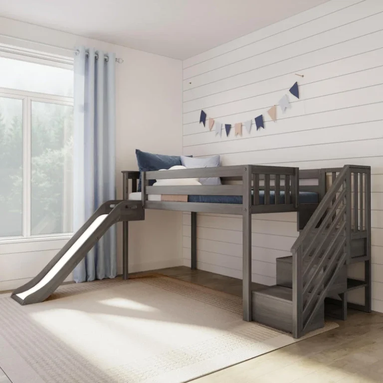 Max and Lily Low Loft Bed With EZ Slide and Staircase in Clay - styled kids' bedroom with the low loft bed, slide on the left, and staircase on the right beside a curtained window.