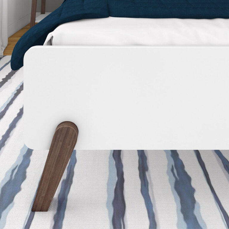 Max and Lily Mid-Century Modern Full Bed - closeup of the footboard panel and angled solid wood leg over an area rug