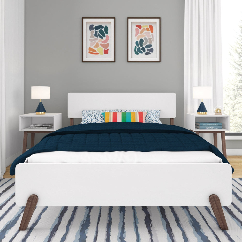 Max and Lily Mid-Century Modern Full Bed in White/Walnut - front view in a styled bedroom showing the curved headboard, footboard and splayed walnut legs