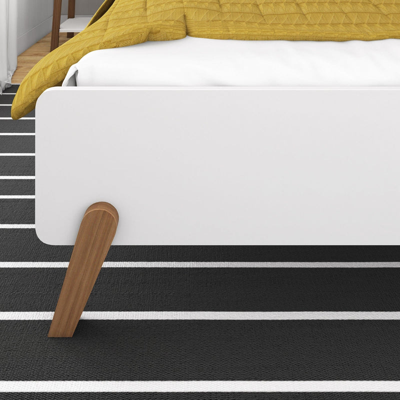 Max and Lily Mid-Century Modern Queen Size Bed in White/Pecan - close-up of the tapered wooden leg and rounded footboard end