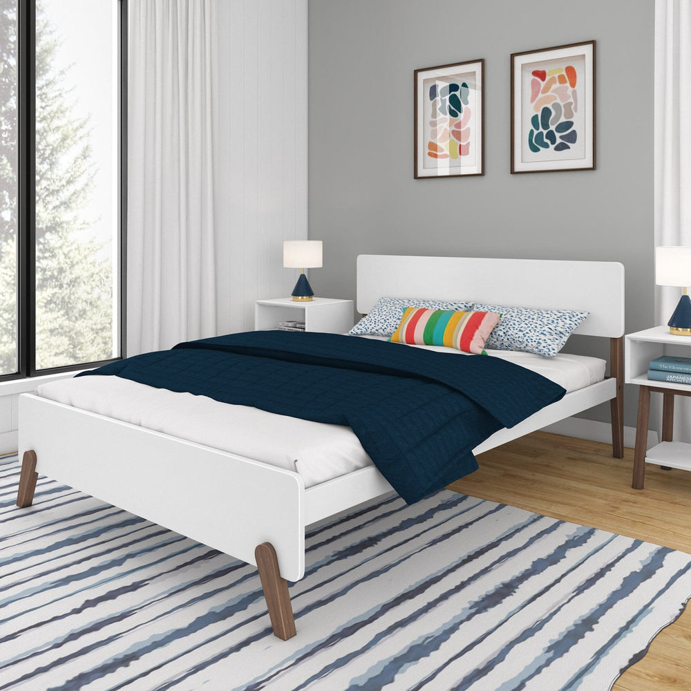 Max and Lily Mid-Century Modern Queen Size Bed in White/Walnut - styled in a bedroom at an angle with nightstands, lamps and a blue striped rug