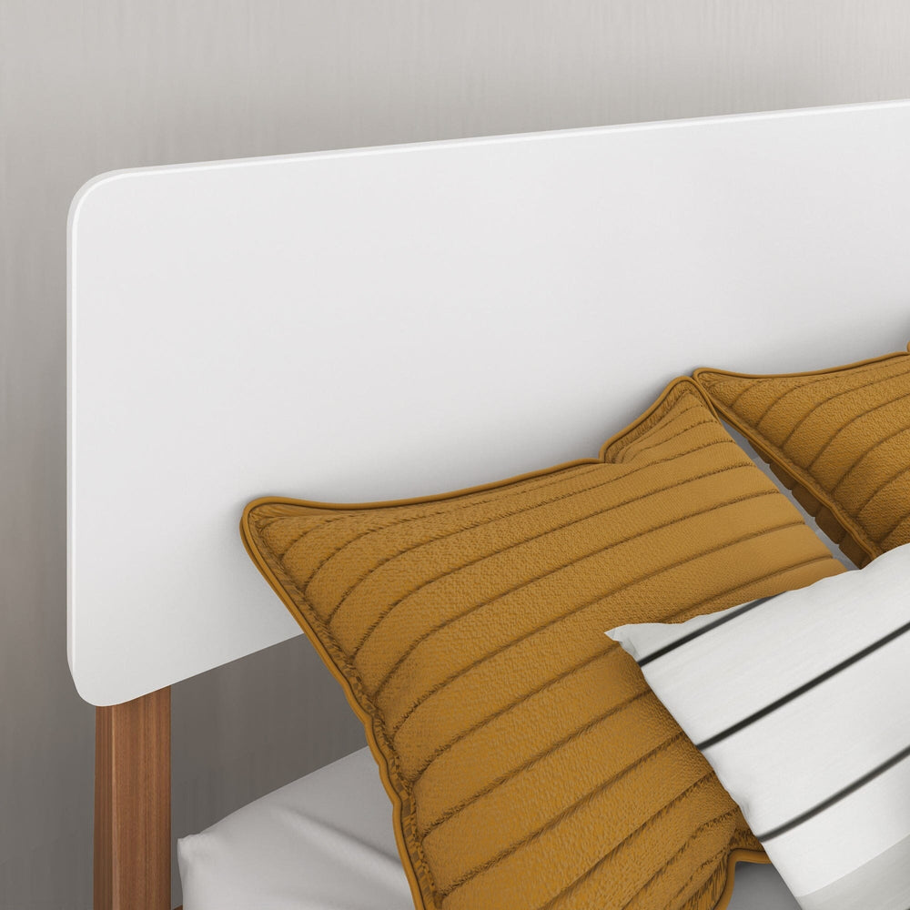 Max and Lily Mid-Century Modern Twin Bed in White/Pecan - closeup of the rounded white headboard panel with mustard and striped pillows
