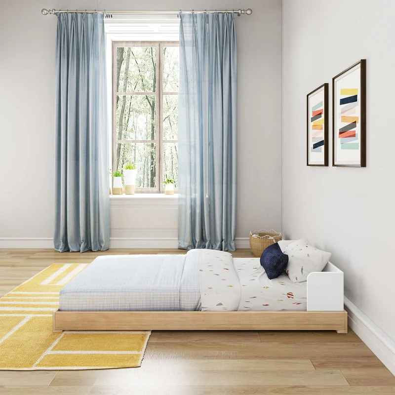 Max and Lily Mid-Century Modern Twin Floor Bed in White/Blonde - side room scene showing how low the platform bed sits to the floor beside tall curtained windows