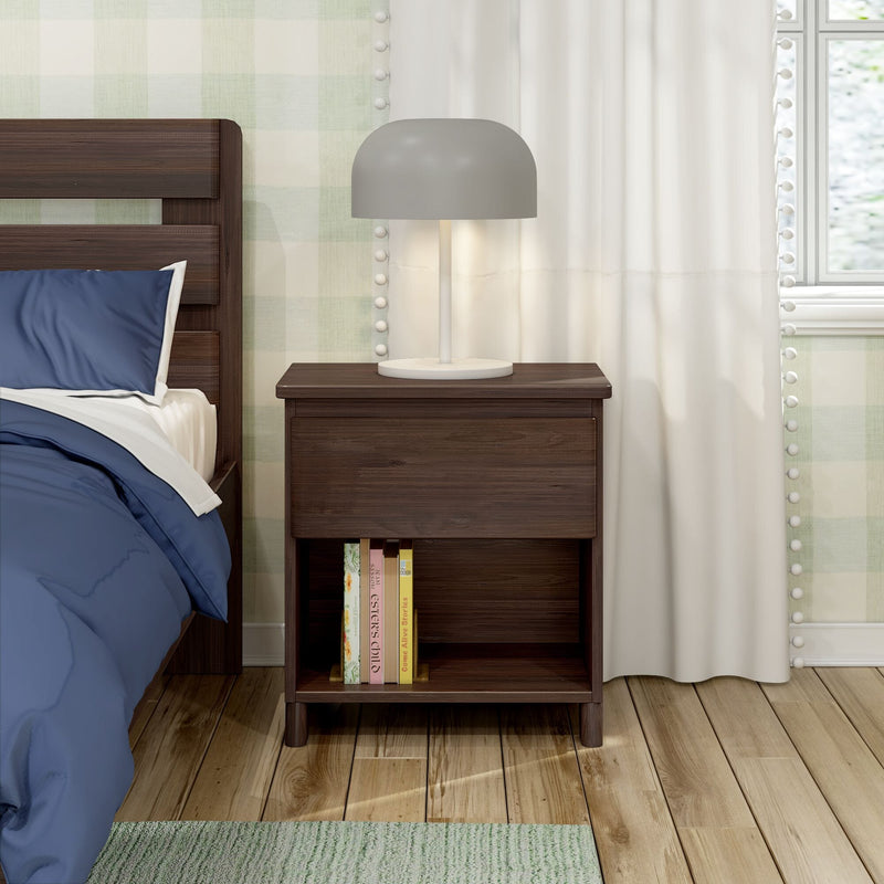 Max And Lily Modern Farmhouse Night Stand Barnwood Brown Room Scene 2 Max and Lily Modern Farmhouse Night Stand in Barnwood Brown - placed beside a bed with a lamp on top and books on the open shelf next to a curtained window