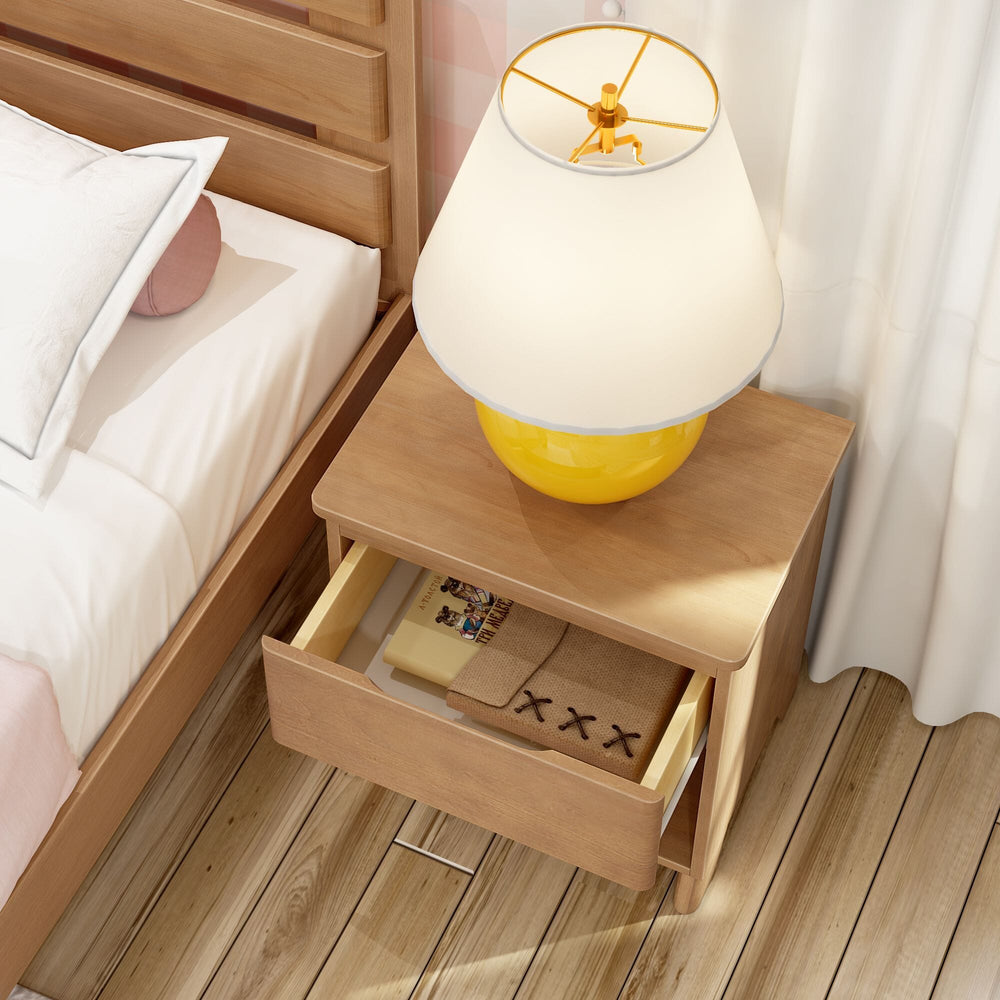 Max And Lily Modern Farmhouse Night Stand Pecan Storage Drawer Open Max and Lily Modern Farmhouse Night Stand in Pecan - top drawer pulled open to reveal storage, with a lamp on top beside the bed.