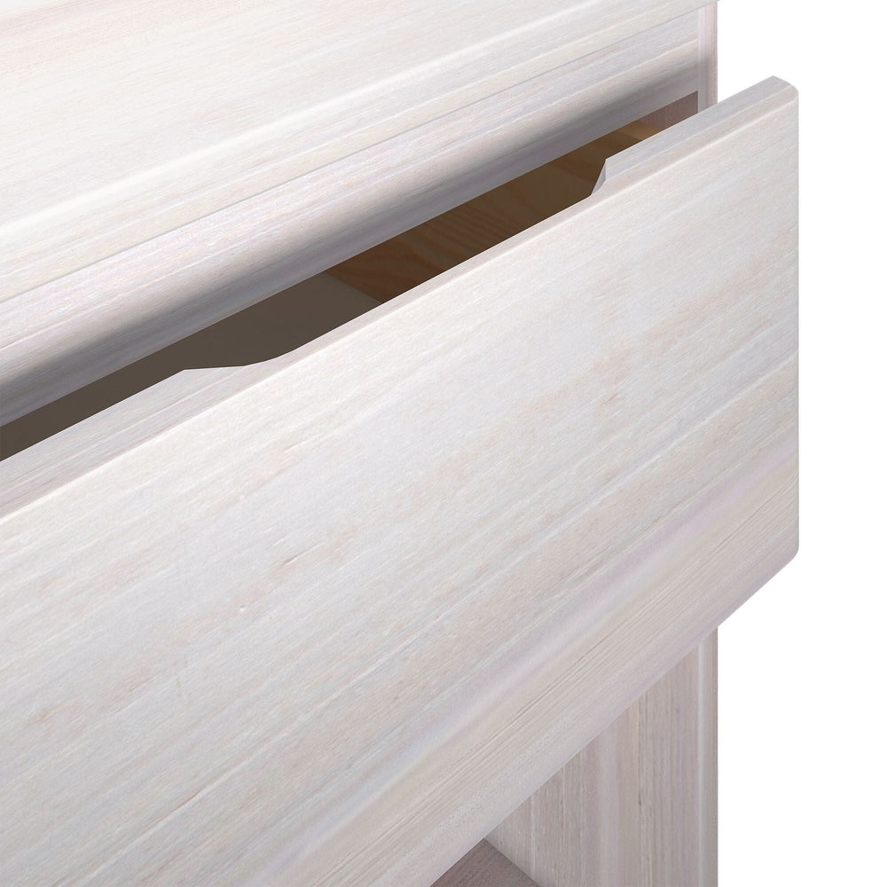 Max And Lily Modern Farmhouse Night Stand White Wash Drawer Detail 8 Max and Lily Modern Farmhouse Night Stand in White Wash - close-up detail of the drawer front and finger-pull opening.