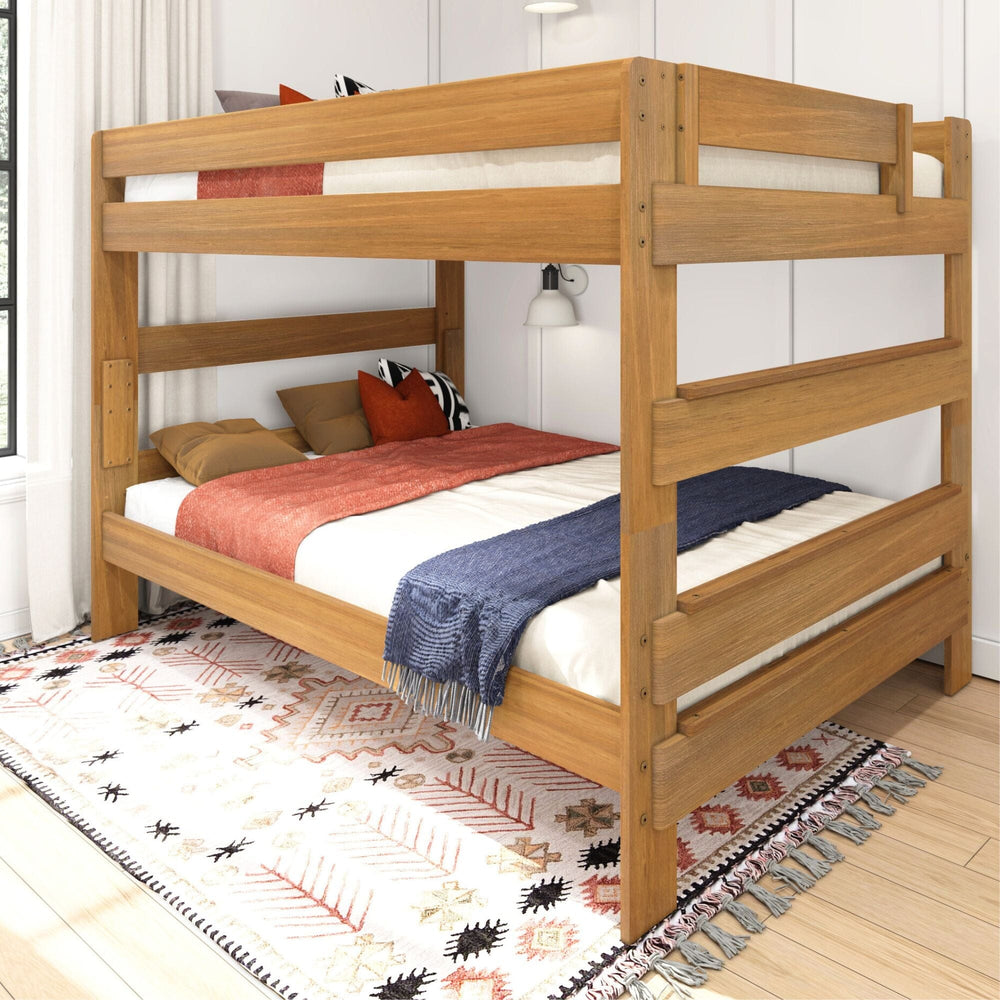 Max and Lily Modern Farmhouse Queen Over Queen Bunk Bed in Pecan - angled view in a styled bedroom with area rug, throw blankets and a wall-mounted reading lamp