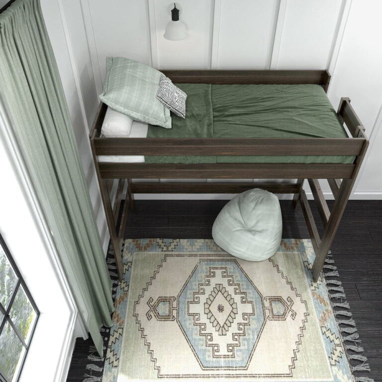 Max And Lily Modern Farmhouse Twin High Loft Bed Barnwood Brown Overhead View Max and Lily Modern Farmhouse Twin High Loft Bed in Barnwood Brown - overhead view of the made bed with green bedding and pillows behind the safety guardrails, with a bean bag on the rug below.