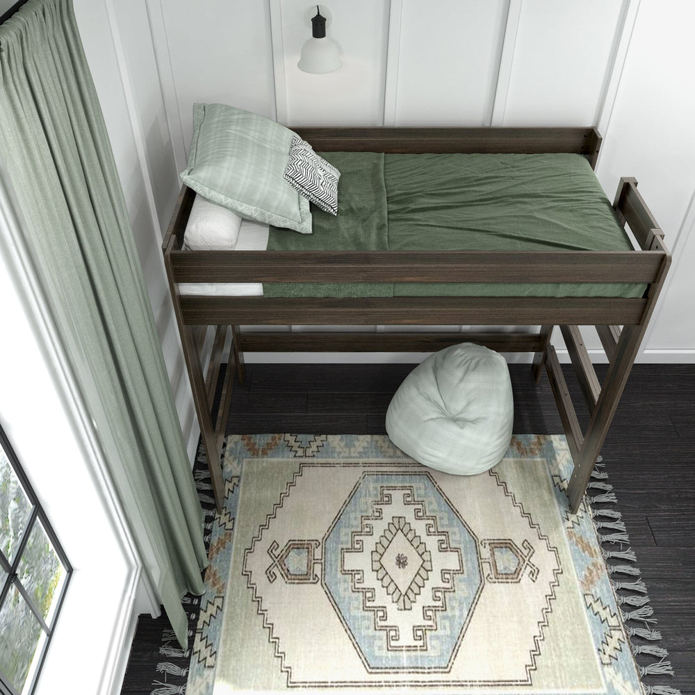 Max and Lily Modern Farmhouse Twin High Loft Bed in Barnwood Brown - overhead view of the made bed with green bedding and pillows behind the safety guardrails, with a bean bag on the rug below.