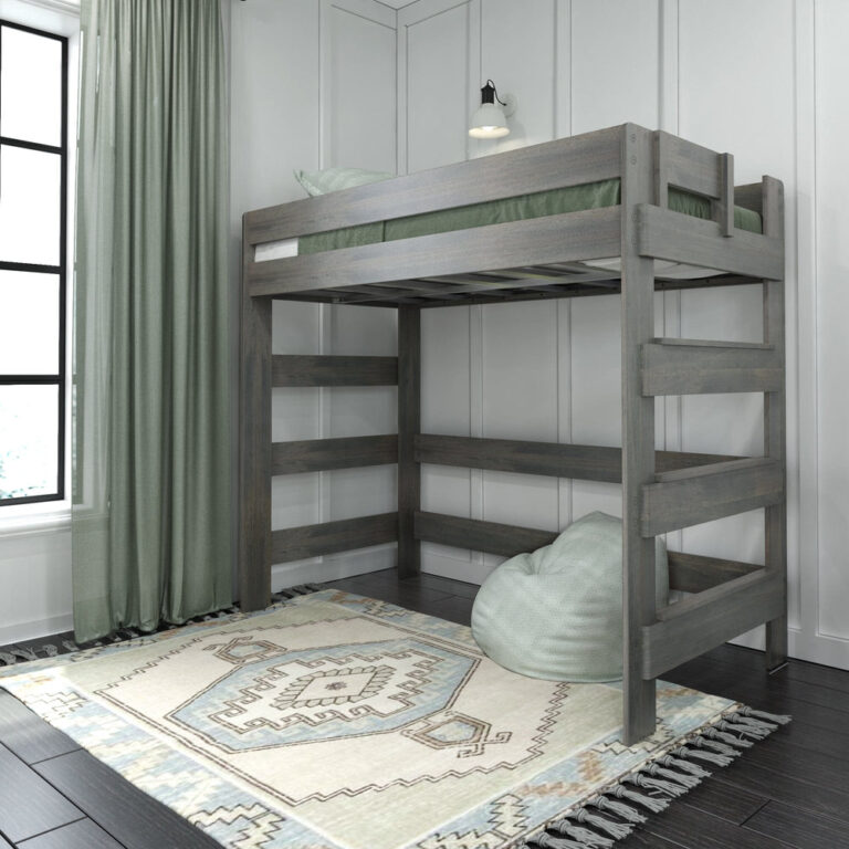 Max And Lily Modern Farmhouse Twin High Loft Bed Driftwood Room Scene Max and Lily Modern Farmhouse Twin High Loft Bed in Driftwood - angled room view of the loft bed with a tall side ladder and full-length guardrails, styled with green curtains, a patterned rug, and a beanbag chair underneath.