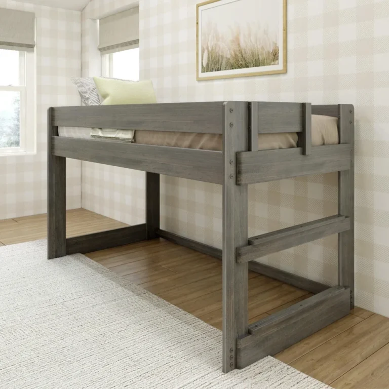 Max And Lily Modern Farmhouse Twin Low Loft Bed Driftwood Angle View 1 Max and Lily Modern Farmhouse Twin Low Loft Bed in Driftwood - angled view showing the low loft with open play space underneath and an integrated end ladder in a checkered wallpaper bedroom.