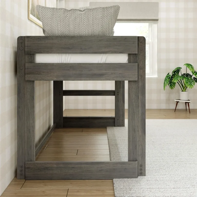 Max And Lily Modern Farmhouse Twin Low Loft Bed Driftwood End View Max and Lily Modern Farmhouse Twin Low Loft Bed in Driftwood - end view showing the built-in ladder and open play space under the low loft with a potted plant nearby.