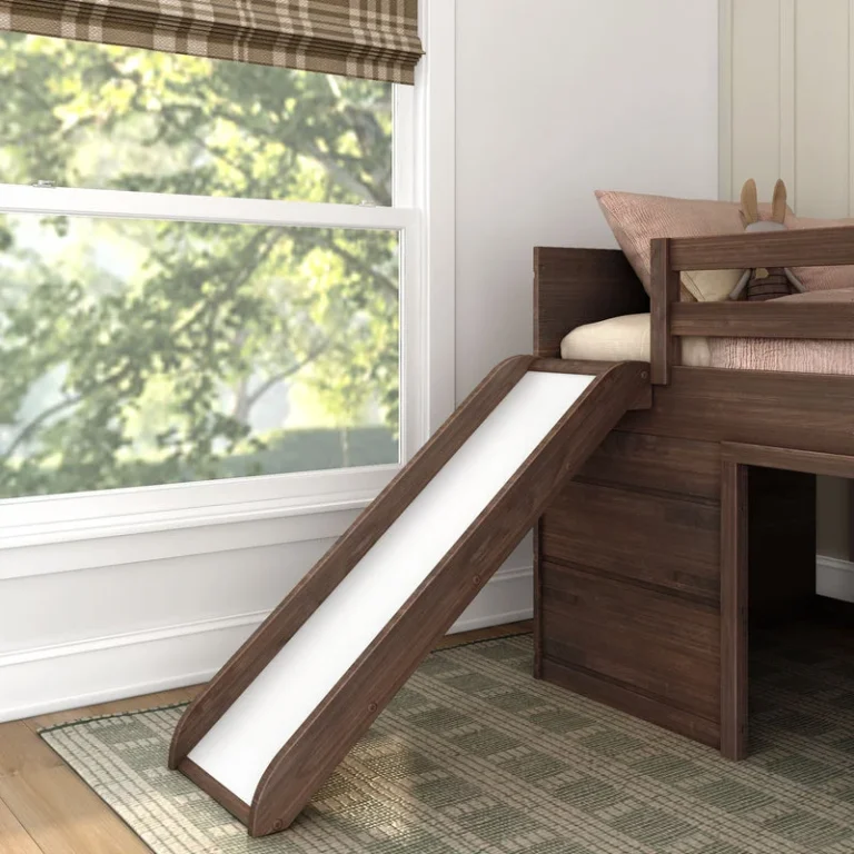 Max And Lily Modern Farmhouse Twin Low Loft Bed With Slide Barnwood Brown Slide Detail 7 Max and Lily Modern Farmhouse Twin Low Loft Bed with Slide in Barnwood Brown - close-up of the white slide beside a window in a styled bedroom setting.