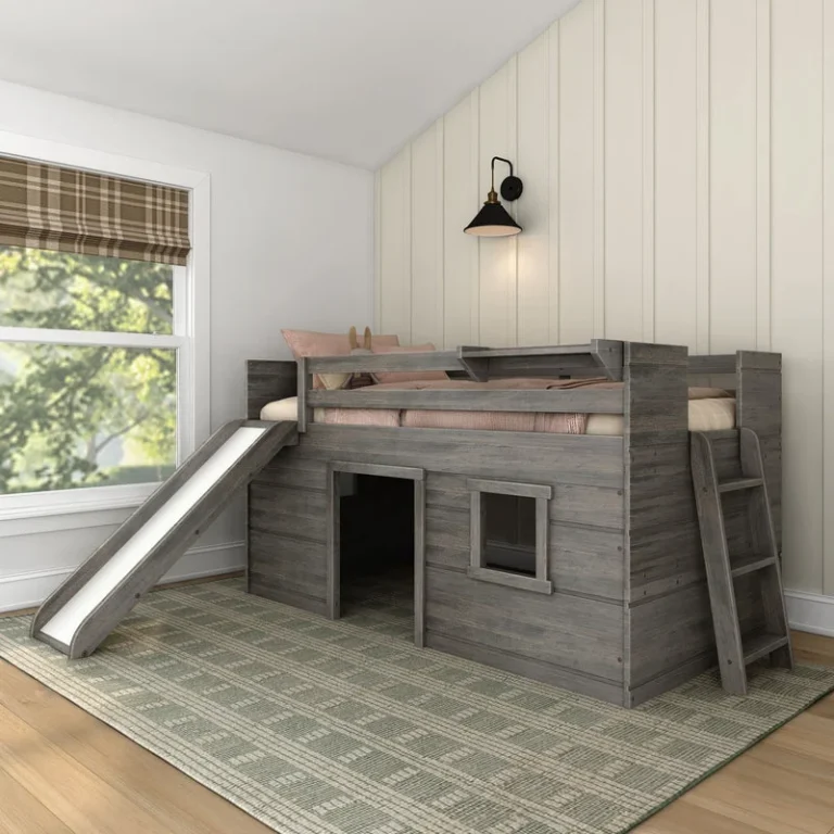 Max And Lily Modern Farmhouse Twin Low Loft Bed With Slide Driftwood Room Scene 1 Max and Lily Modern Farmhouse Twin Low Loft Bed with Slide in Driftwood - styled bedroom scene showing the wave slide, end ladder, and enclosed playhouse base with a window cutout.