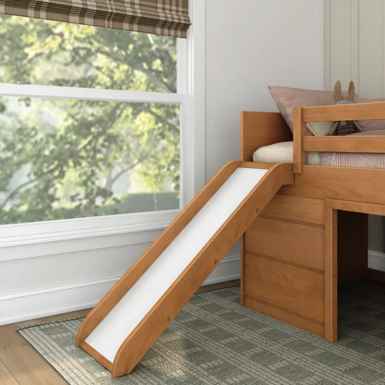 Max And Lily Modern Farmhouse Twin Low Loft Bed With Slide Pecan Slide Detail 7 Max and Lily Modern Farmhouse Twin Low Loft Bed with Slide in Pecan - the slide descending toward the floor beside a bright window in a decorated bedroom