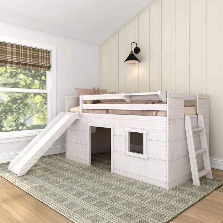 Max And Lily Modern Farmhouse Twin Low Loft Bed With Slide White Room Scene 1 Max and Lily Modern Farmhouse Twin Low Loft Bed in White - angled room view showing the attached slide, side ladder, and playhouse window cutout beneath the loft.