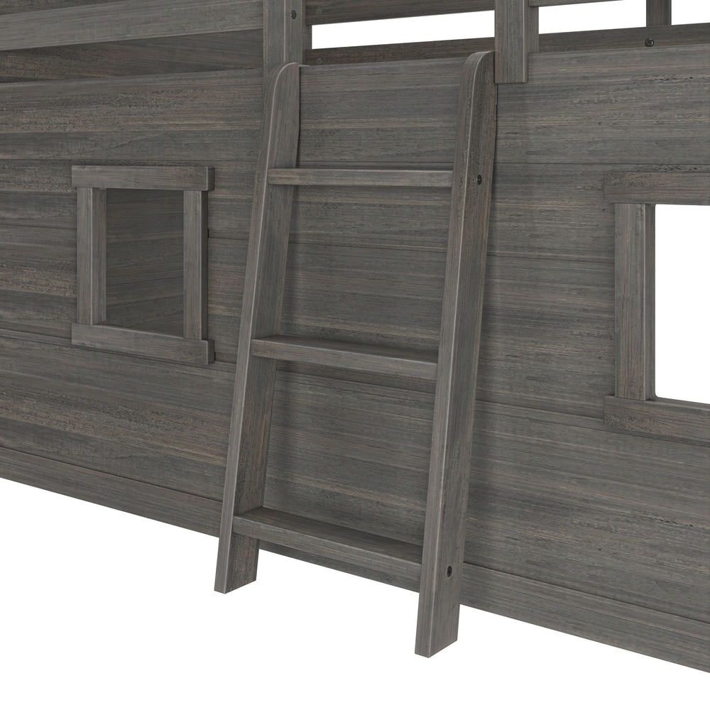 Max And Lily Modern Farmhouse Twin Low Loft Driftwood Ladder Detail 5 Max and Lily Modern Farmhouse Twin Low Loft in Driftwood - close-up of the angled ladder rungs beside a cut-out playhouse window.