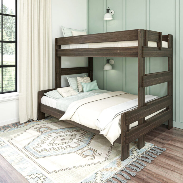Max and Lily Modern Farmhouse Twin Over Full Bunk Bed in Barnwood Brown - angled room view with both bunks styled with bedding against a green panelled wall with wall sconces.