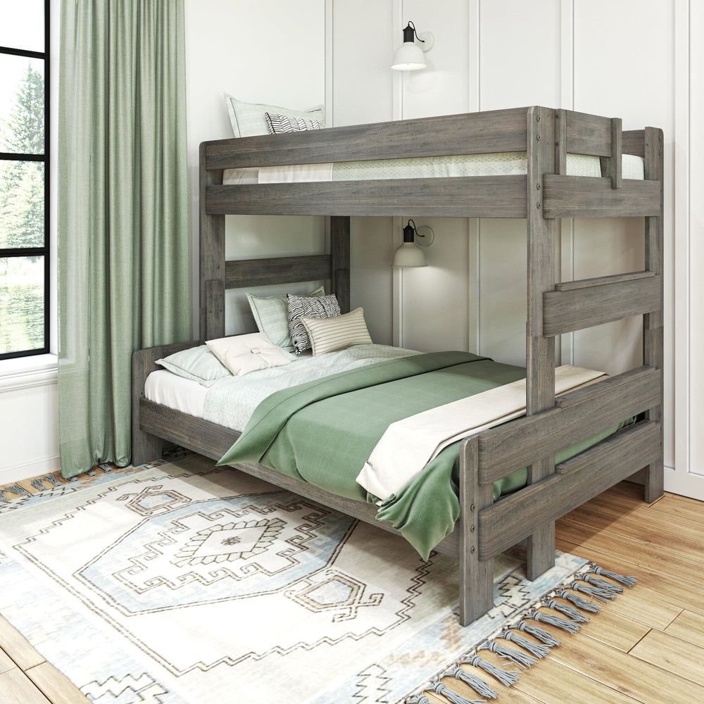 Max and Lily Modern Farmhouse Twin Over Full Bunk Bed in Driftwood - angled view in a styled bedroom with green curtains, wall sconces and a patterned rug.