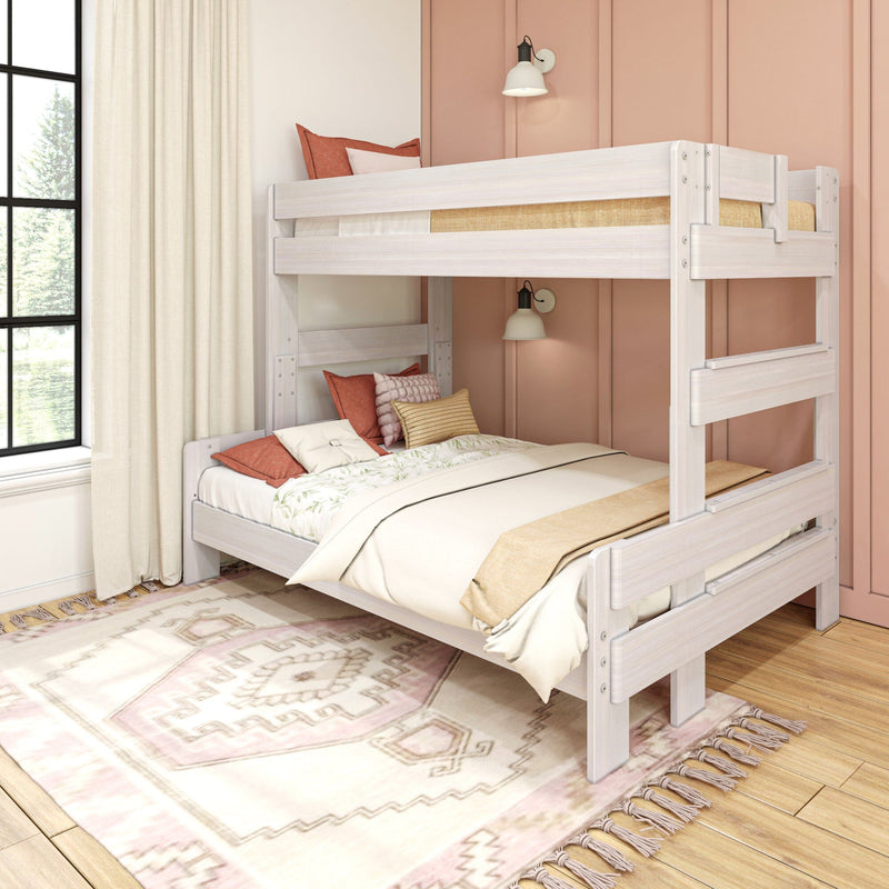 Max and Lily Modern Farmhouse Twin Over Full Bunk Bed - angled view in a styled bedroom showing the full-size lower bunk, upper safety guardrails, and integrated end ladder.