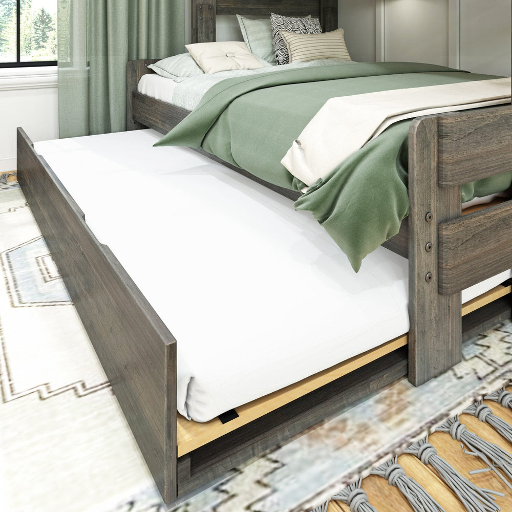 Max and Lily Modern Farmhouse Twin Over Full Bunk Bed With Trundle in Driftwood - close-up of the pull-out trundle bed extended from under the lower bunk in a bedroom setting.