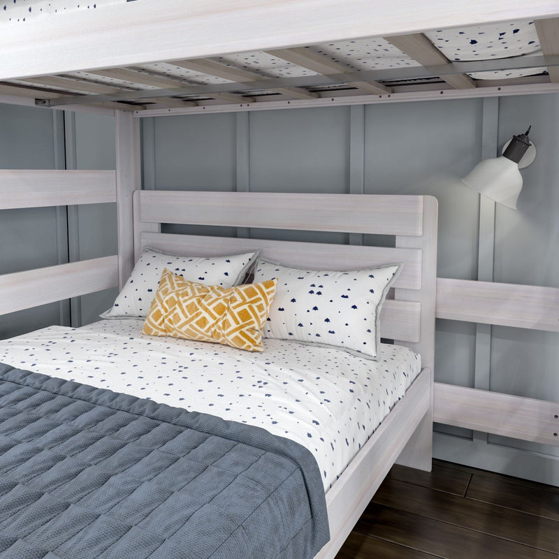 Max and Lily Modern Farmhouse Twin Over Full L-Shaped Bunk Bed in White Wash - close-up of the lower full bed with headboard and wall reading lamp beneath the upper bunk.