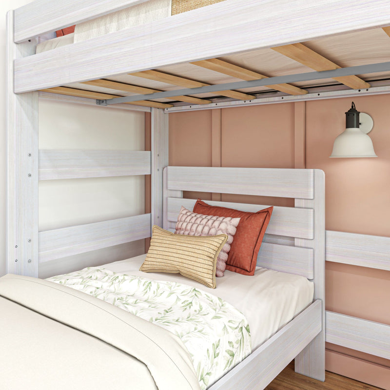 Max and Lily Modern Farmhouse Twin Over Twin L-Shaped Bunk Bed in White Wash - close view of the wooden slat supports under the upper bunk and the lower twin bed headboard.