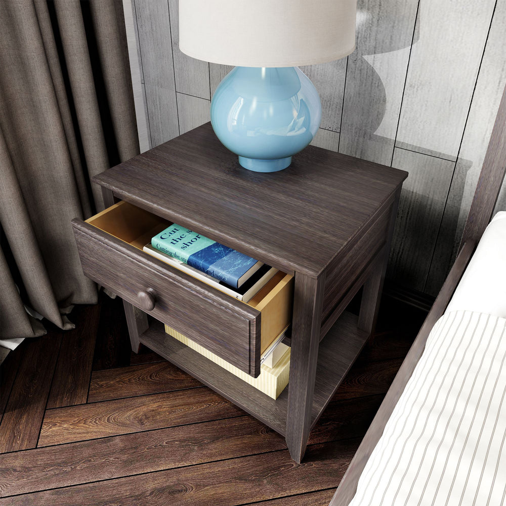 Max and Lily Night Stand With Drawer and Shelf in Clay - angled view with the drawer pulled open to reveal books stored inside and a lamp on top.