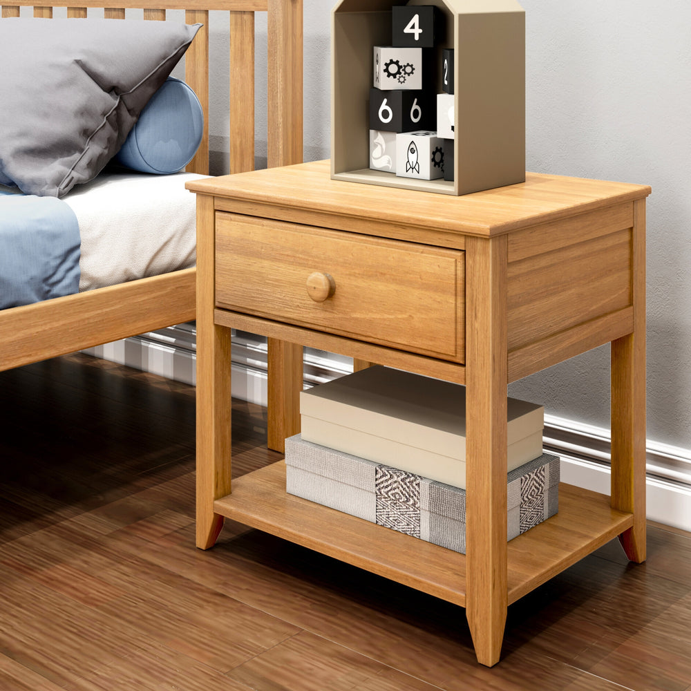 Max and Lily Night Stand With Drawer and Shelf in Pecan - placed beside a bed with toys on top and books on the open lower shelf