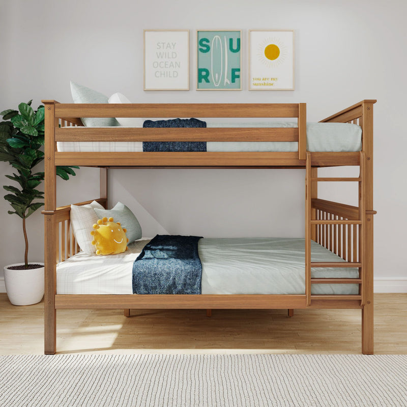 Max and Lily Queen Over Queen Bunk Bed in Pecan - front view staged in a bedroom with a potted plant and framed wall prints.